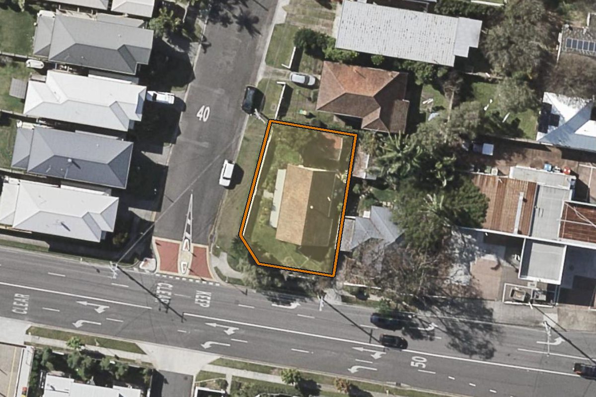 Aerial photo of 1 Douglas Street, Enoggera QLD 4051 with the lot boundary outlined in amber
