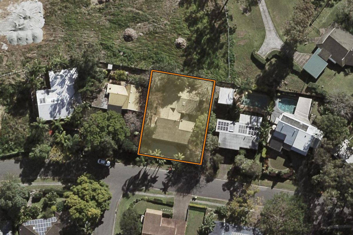 Aerial photo of 11 Wyndarra Street, Kenmore QLD 4069 with the lot boundary outlined in amber