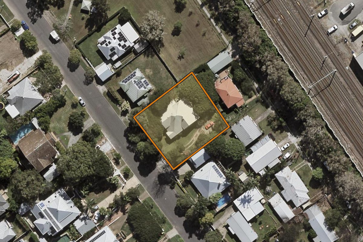 Aerial photo of 112 Gympie Street, Northgate QLD 4013 with the lot boundary outlined in amber