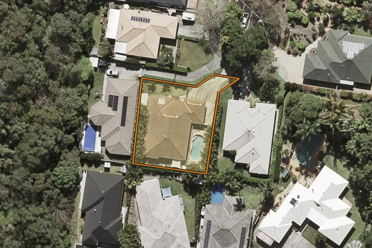 Aerial photo of 12 Remington Rise, Palmwoods QLD 4555 with the lot boundary outlined in amber