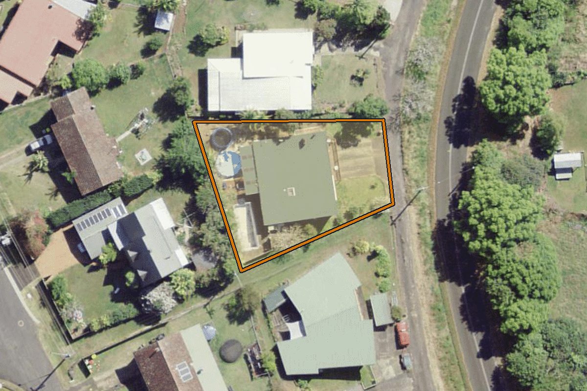 Aerial photo of 121 Donnans Road, Lismore Heights NSW 2480 with the lot boundary outlined in amber