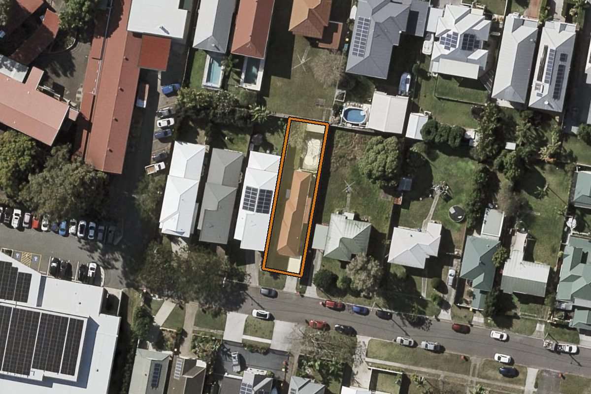 Aerial photo of 124 Childers Street, Wavell Heights QLD 4012 with the lot boundary outlined in amber