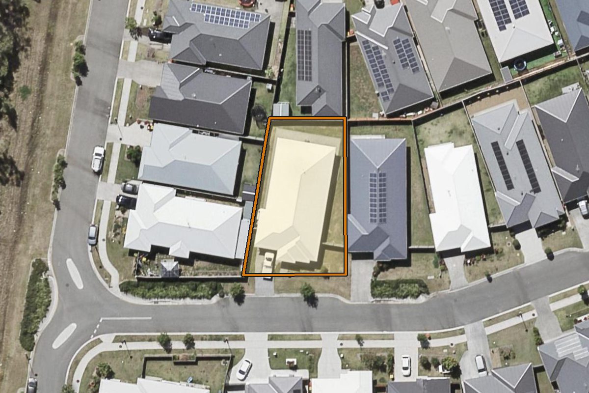 Aerial photo of 13 Skyring Street, Greenbank QLD 4124 with the lot boundary outlined in amber