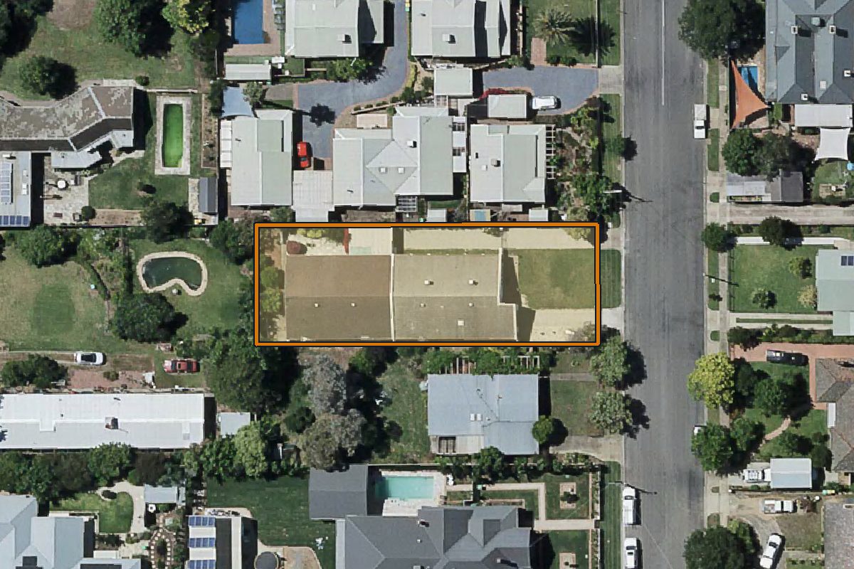 Aerial photo of 13 Tom Street, Yarrawonga VIC 3730 with the lot boundary outlined in amber