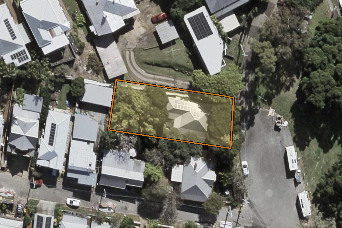 Aerial photo of 138 Kelvin Grove Road, Kelvin Grove QLD 4059 with the lot boundary outlined in amber