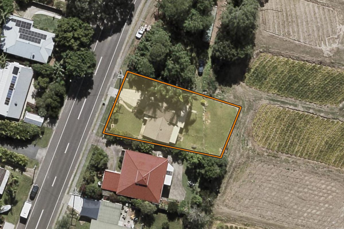 Aerial photo of 153 Coes Creek Road, Coes Creek QLD 4560 with the lot boundary outlined in amber