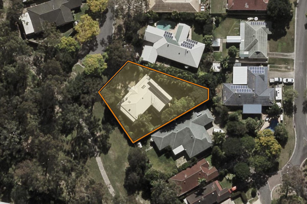 Aerial photo of 18 Agathis Place, Forest Lake QLD 4078 with the lot boundary outlined in amber