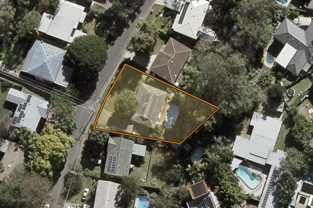 Aerial photo of 18 Fallbrook Street, Kenmore QLD 4069 with the lot boundary outlined in amber