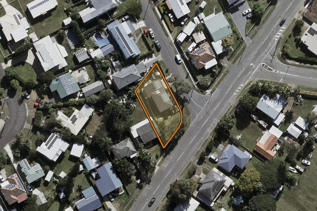 Aerial photo of 2 Bushing Street, Wynnum West QLD 4178 with the lot boundary outlined in amber