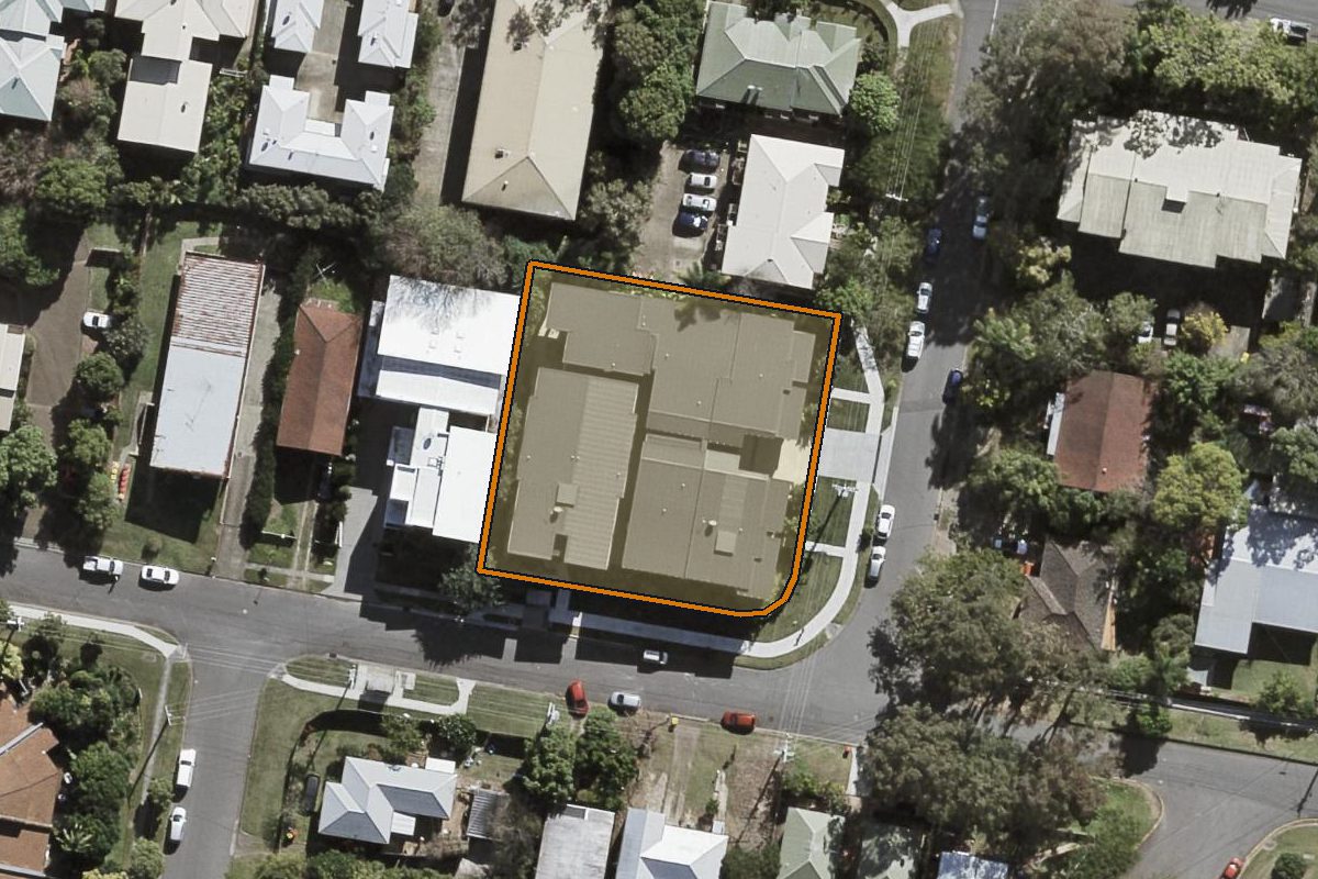 Aerial photo of 2 Woolley Street, Indooroopilly QLD 4068 with the lot boundary outlined in amber