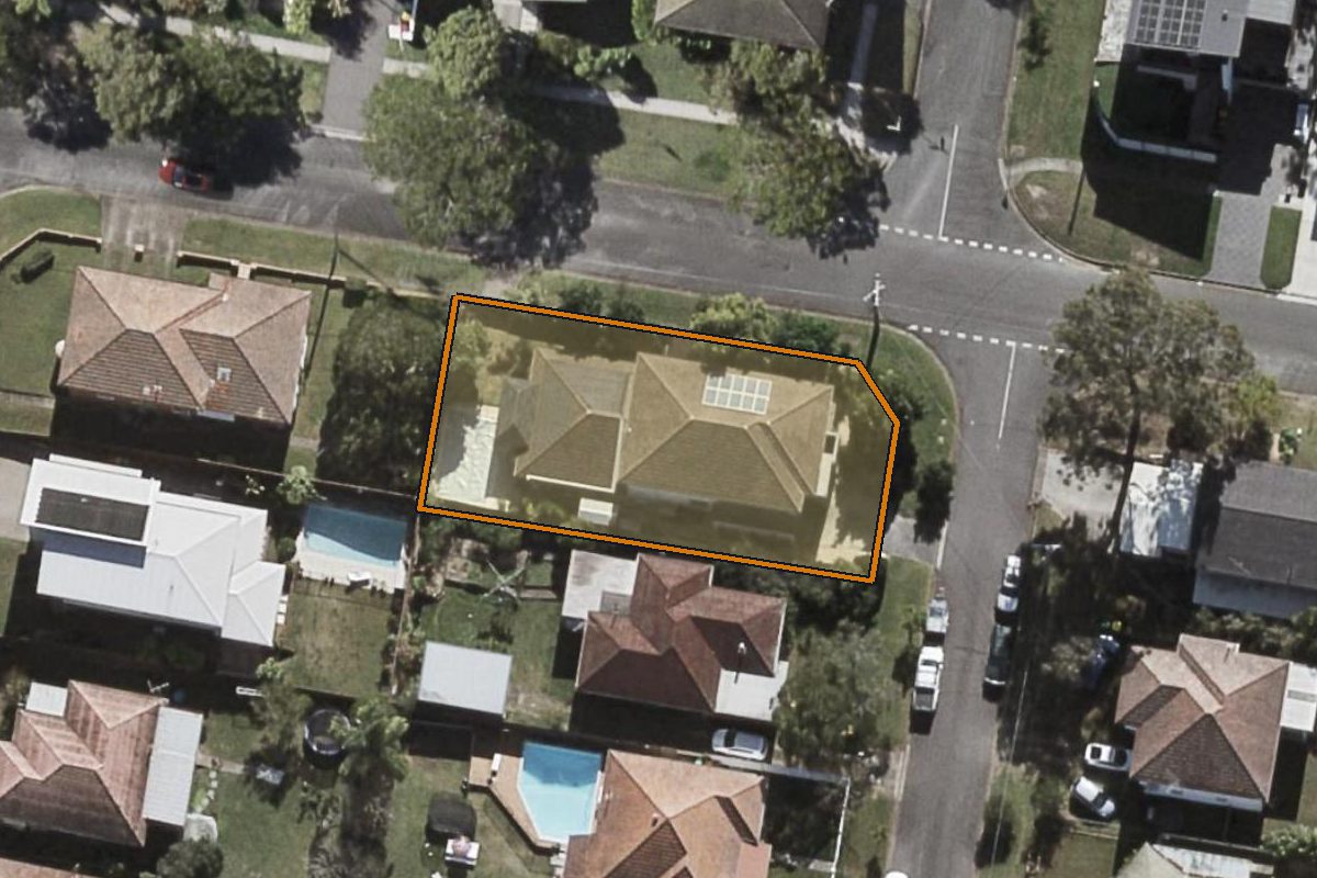 Aerial photo of 20 Noeline Street, Ashgrove QLD 4060 with the lot boundary outlined in amber