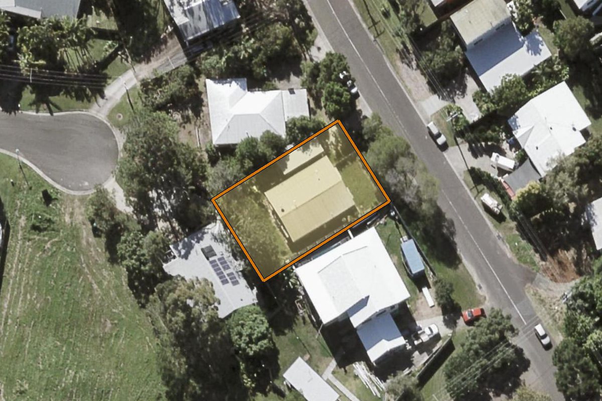 Aerial photo of 218 Centenary Heights Road, Coolum Beach QLD 4573 with the lot boundary outlined in amber