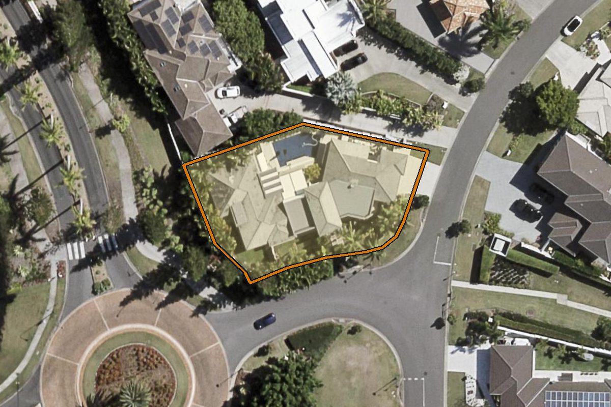 Aerial photo of 2201 Taromeo Court, Hope Island QLD 4212 with the lot boundary outlined in amber
