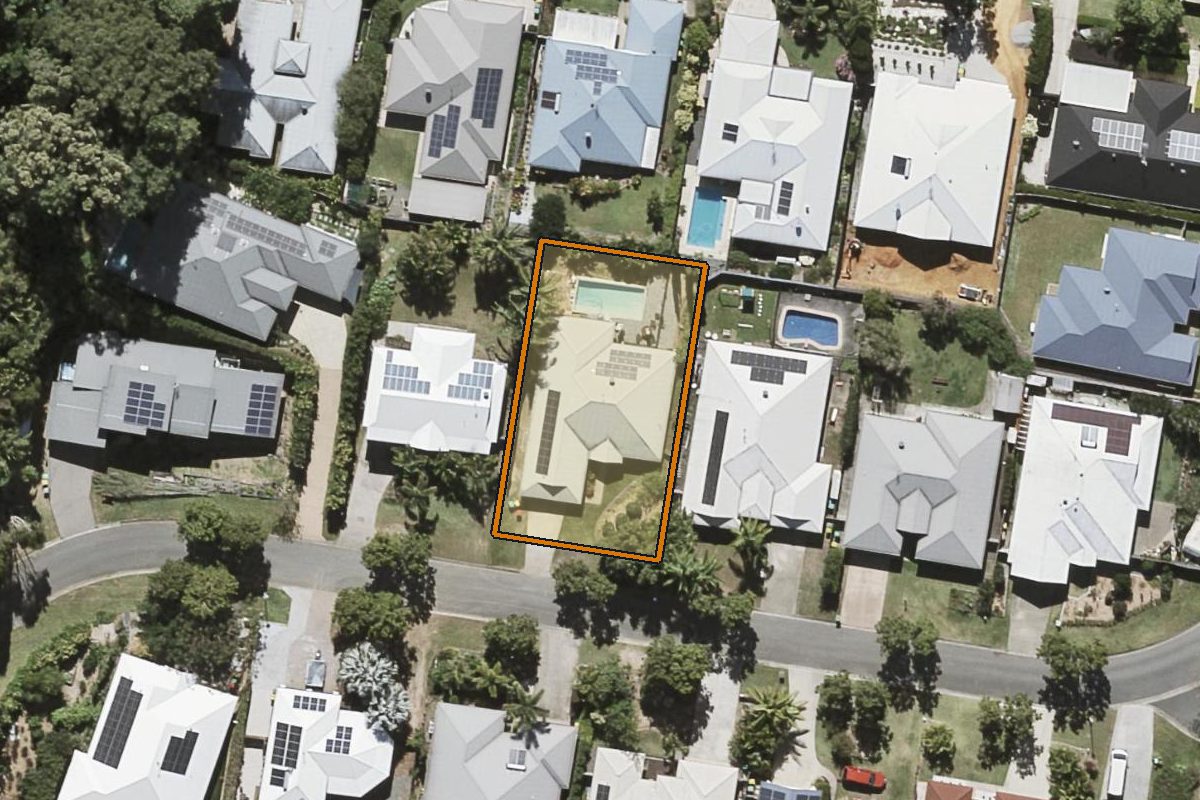 Aerial photo of 24 Yellow Cedar Place, Palmwoods QLD 4555 with the lot boundary outlined in amber