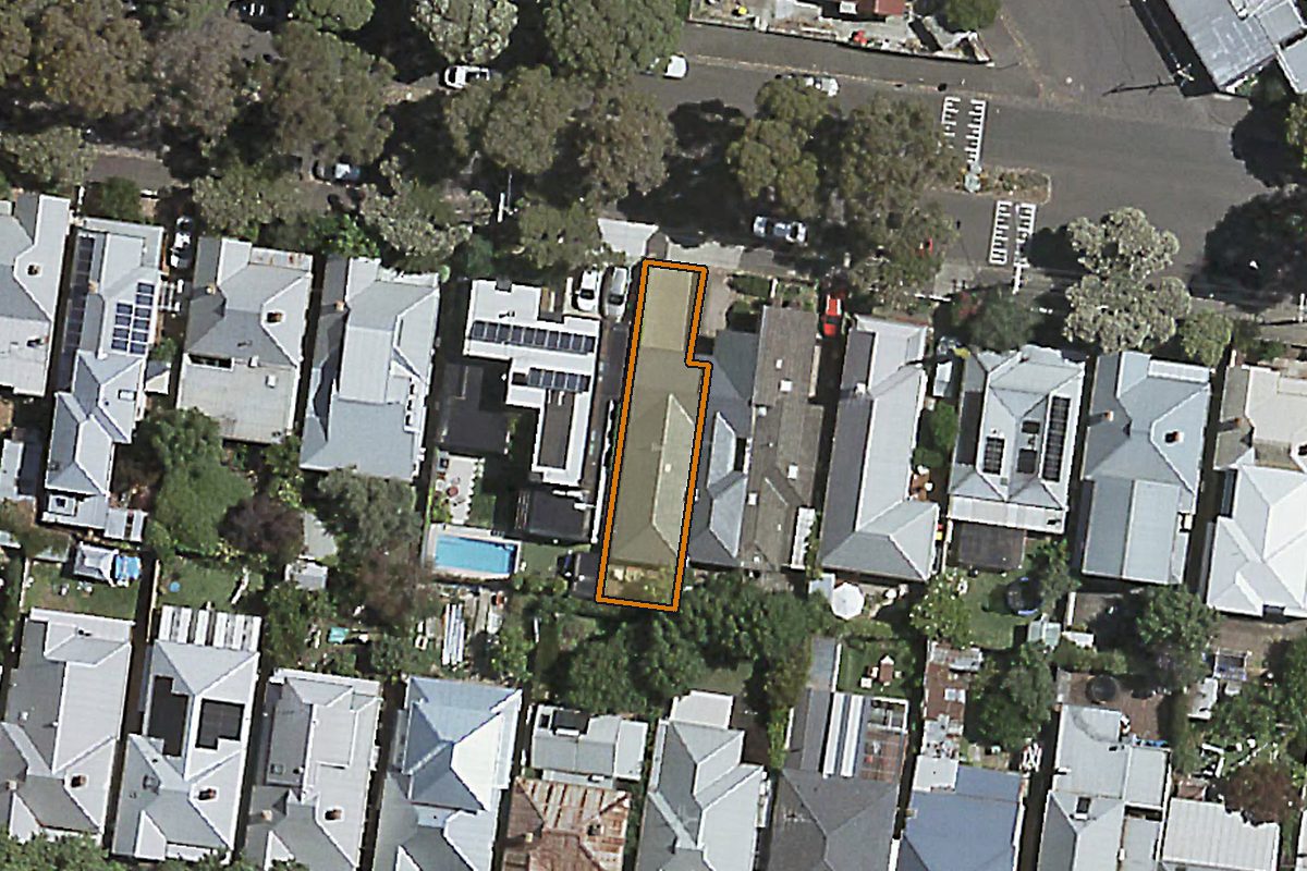 Aerial photo of 27 Edinburgh Street, Flemington VIC 3031 with the lot boundary outlined in amber