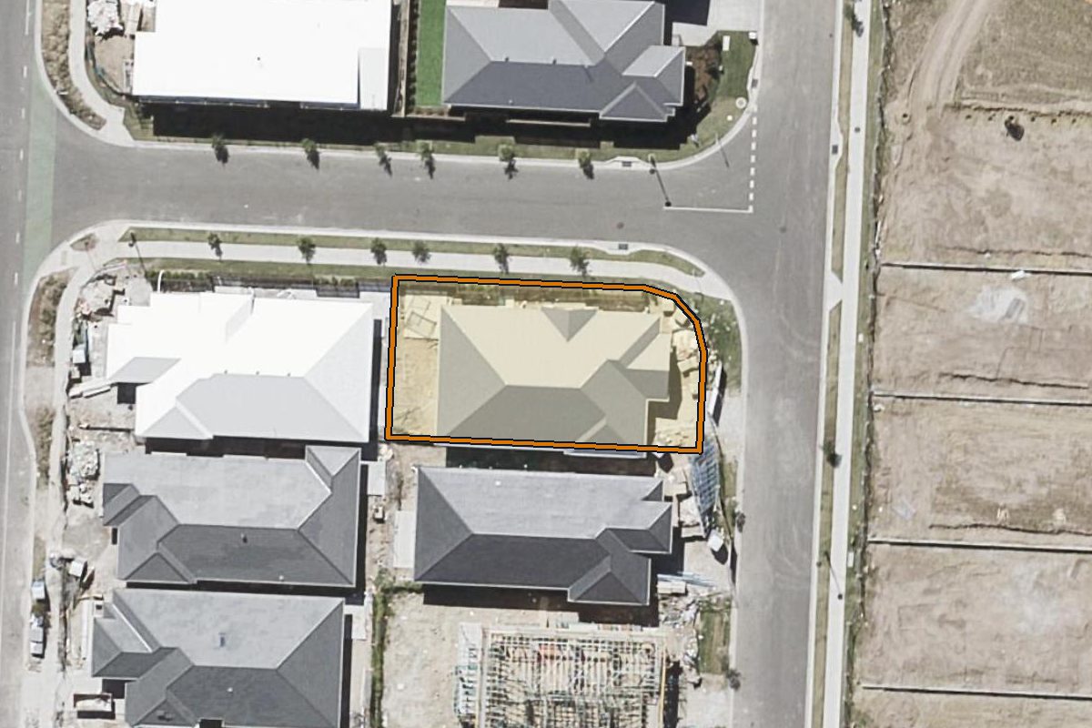 Aerial photo of 27 Tuscan Circuit, Greenbank QLD 4124 with the lot boundary outlined in amber
