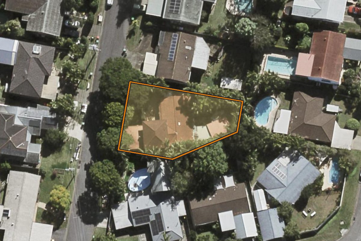 Aerial photo of 28 Harefield Street, Indooroopilly QLD 4068 with the lot boundary outlined in amber
