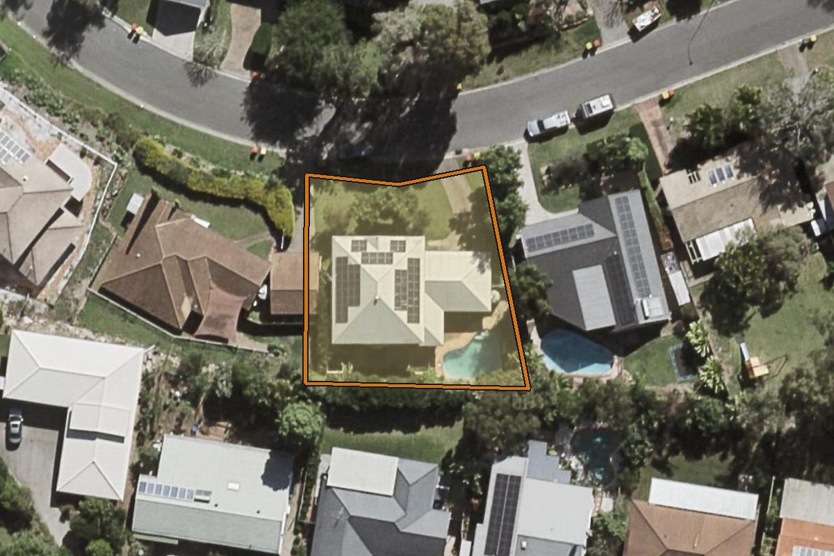 Aerial photo of 32 Wyndarra Street, Kenmore QLD 4069 with the lot boundary outlined in amber