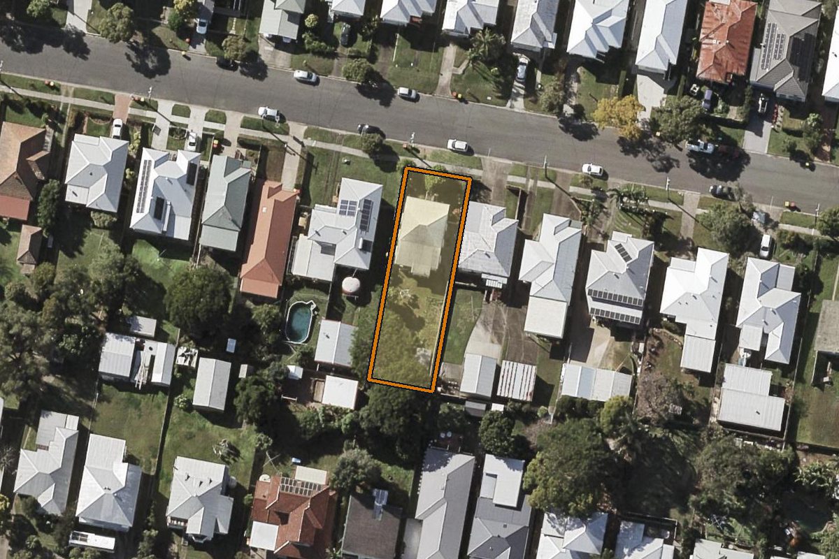 Aerial photo of 34 Reuben Street, Stafford QLD 4053 with the lot boundary outlined in amber