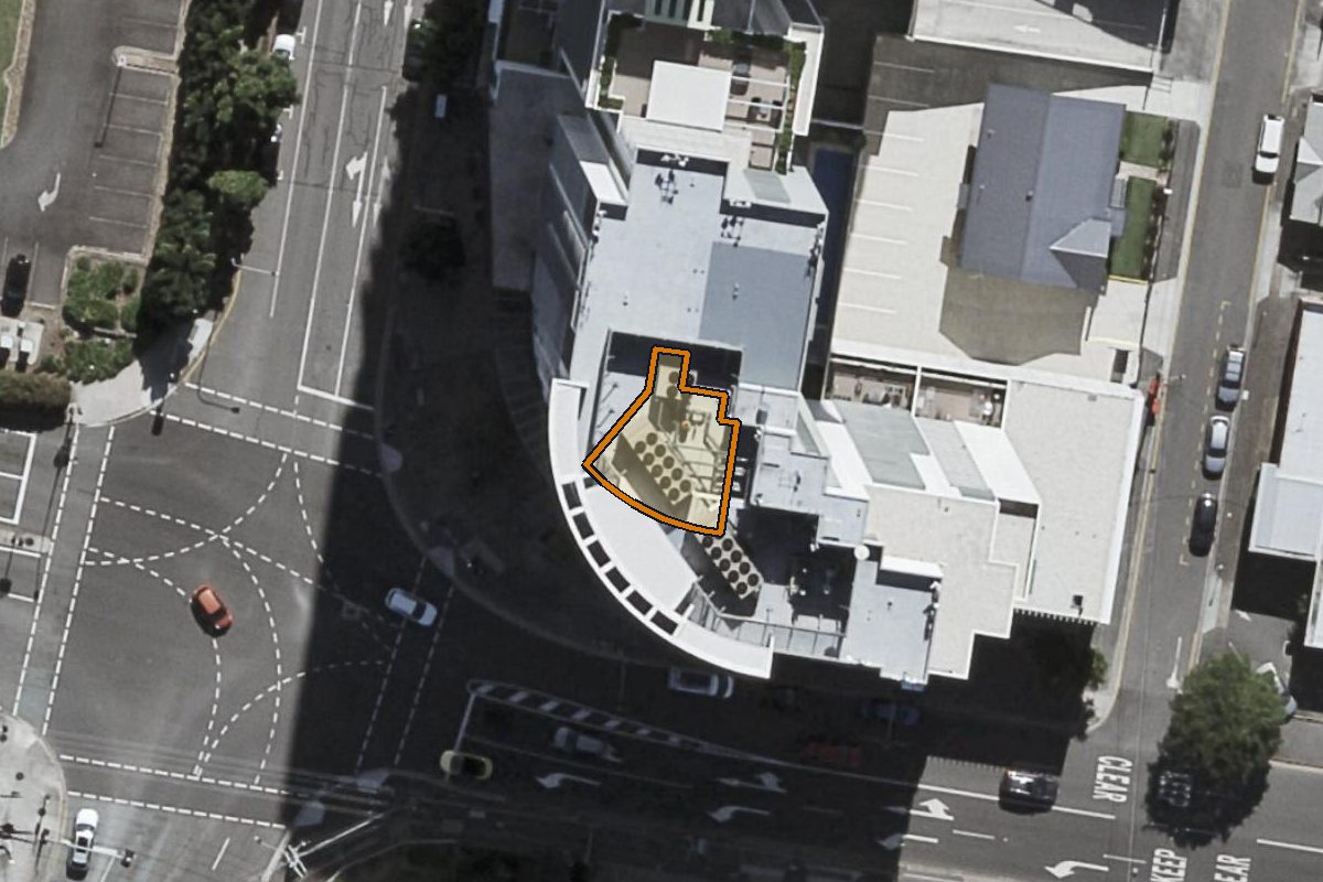 Aerial photo of 35 Campbell Street, Bowen Hills QLD 4006 with the lot boundary outlined in amber
