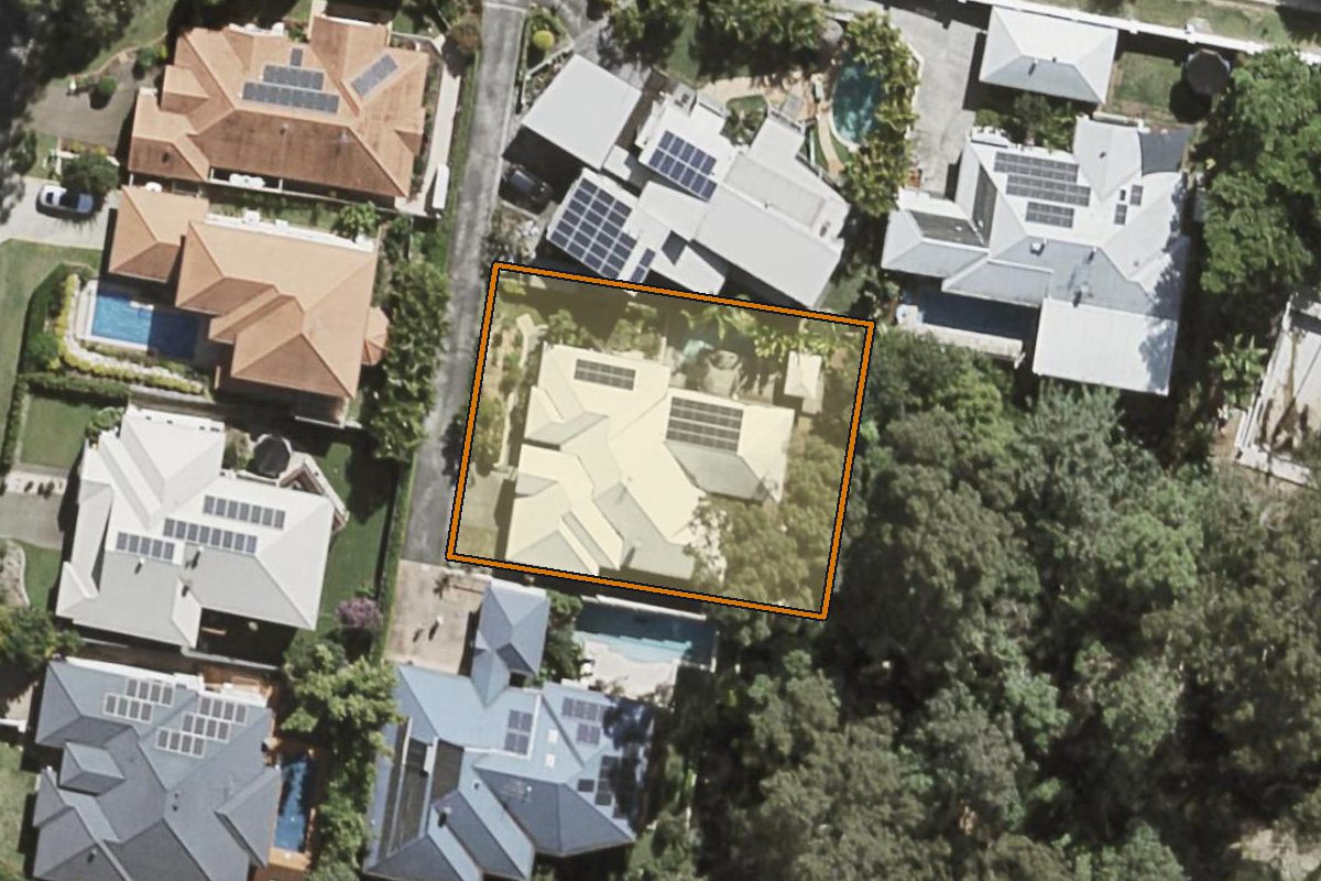 Aerial photo of 4 Carissa Place, Chapel Hill QLD 4069 with the lot boundary outlined in amber