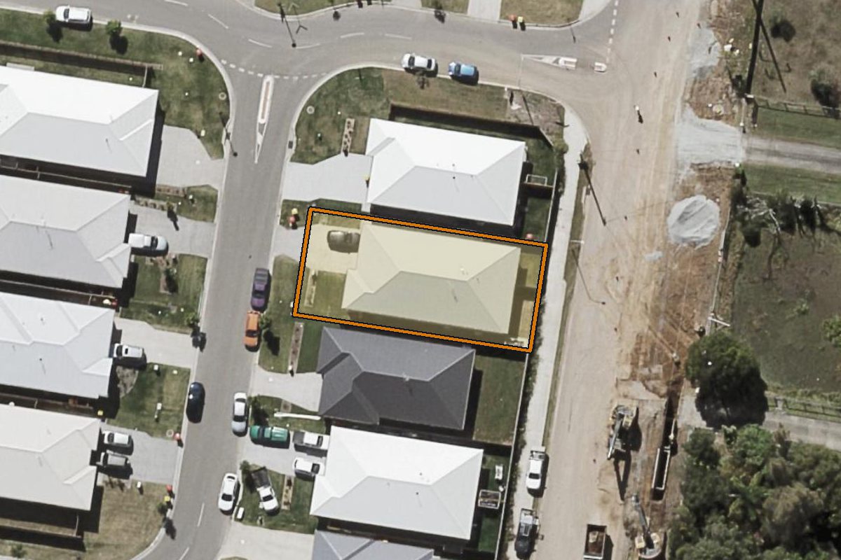 Aerial photo of 4 Fanflower Street, Logan Reserve QLD 4133 with the lot boundary outlined in amber