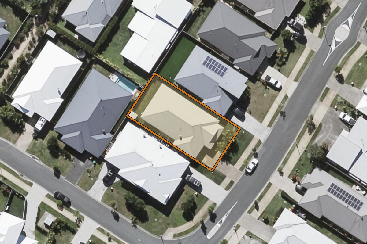 Aerial photo of 40 Kauri Crescent, Peregian Springs QLD 4573 with the lot boundary outlined in amber