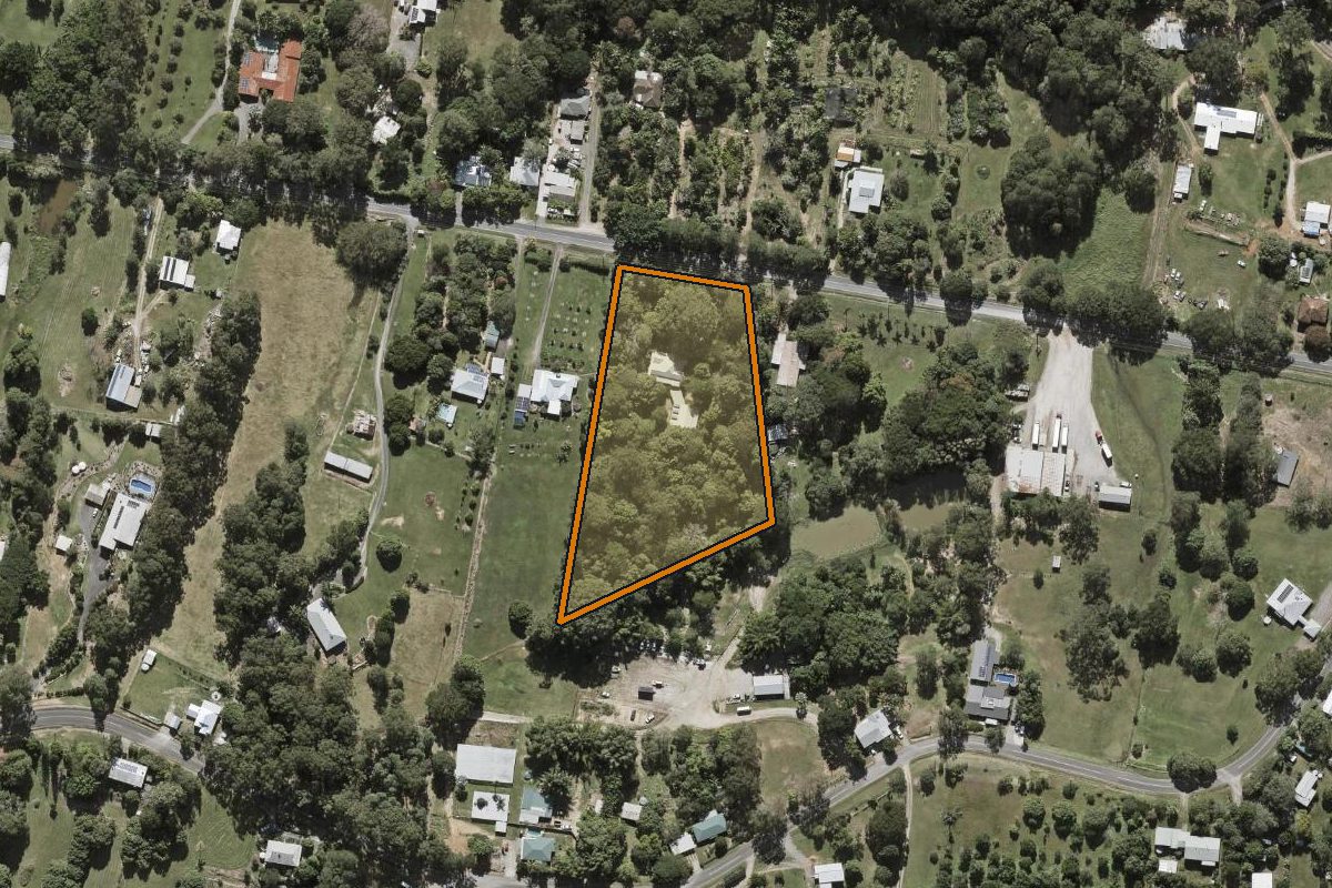 Aerial photo of 40 Reids Road, West Woombye QLD 4559 with the lot boundary outlined in amber