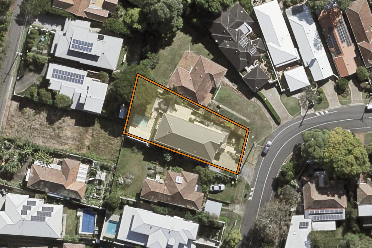 Aerial photo of 427 Swann Road, St Lucia QLD 4067 with the lot boundary outlined in amber