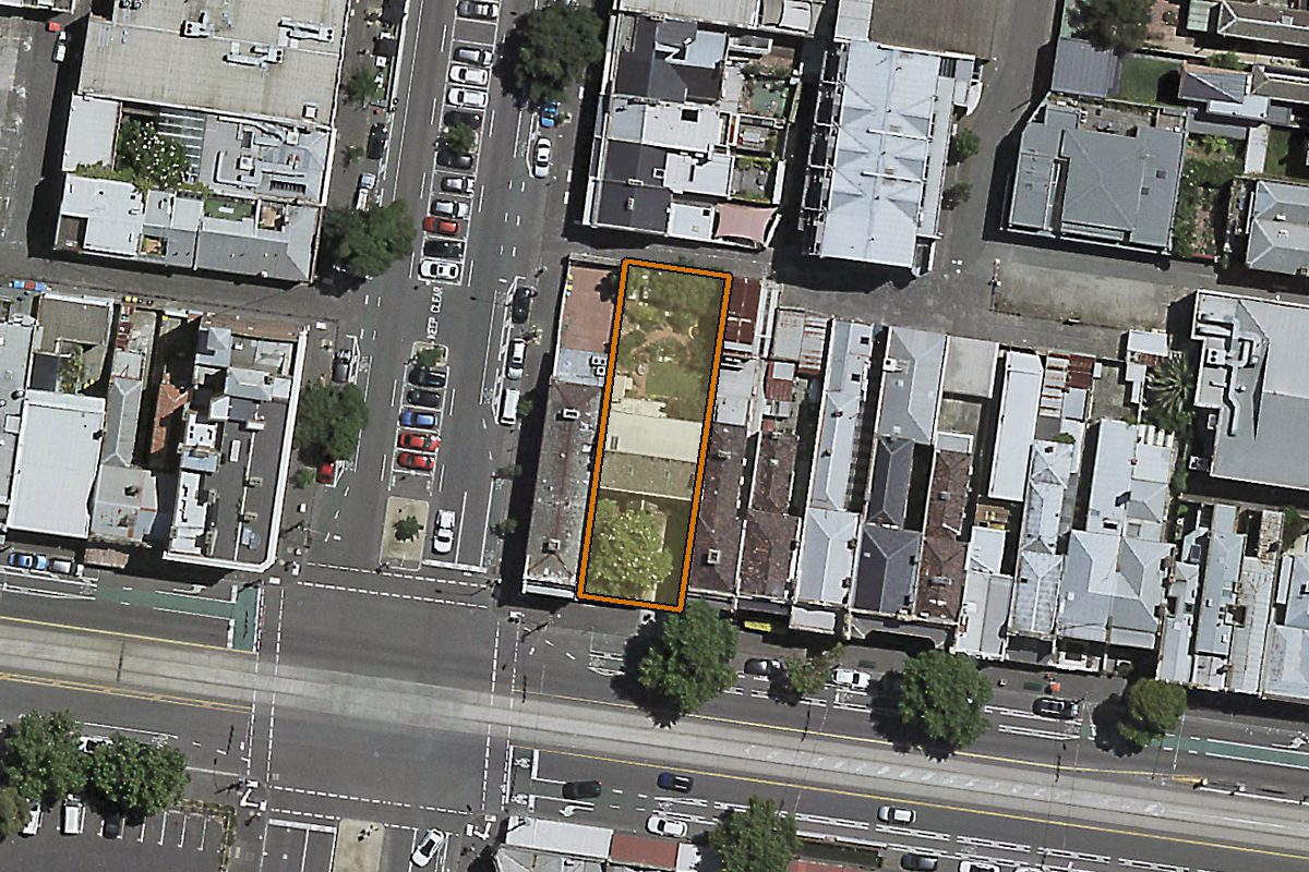 Aerial photo of 454-458 Victoria Street, North Melbourne VIC 3051 with the lot boundary outlined in amber