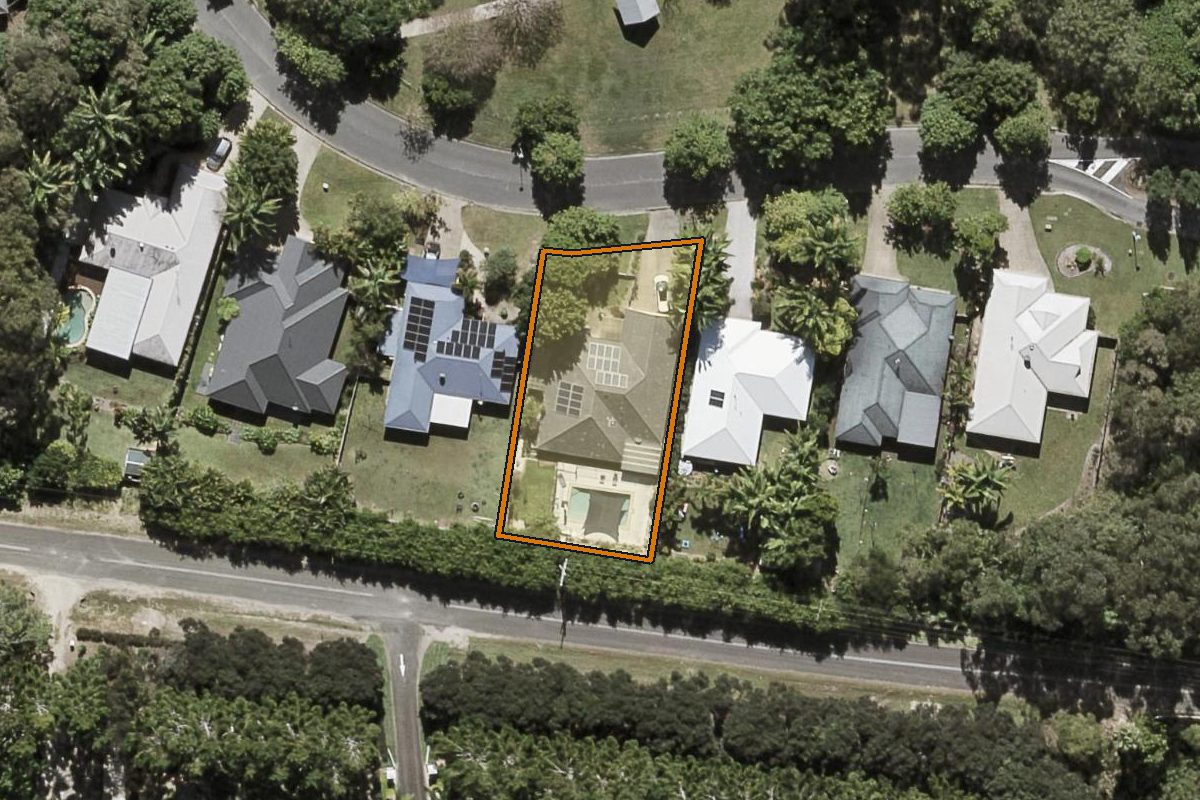 Aerial photo of 49 Petigrain Avenue, Palmwoods QLD 4555 with the lot boundary outlined in amber