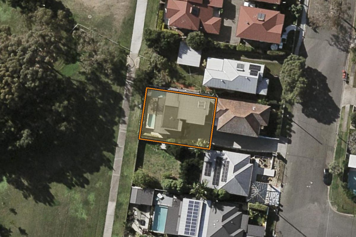 Aerial photo of 49A Burnaby Terrace, Gordon Park QLD 4031 with the lot boundary outlined in amber