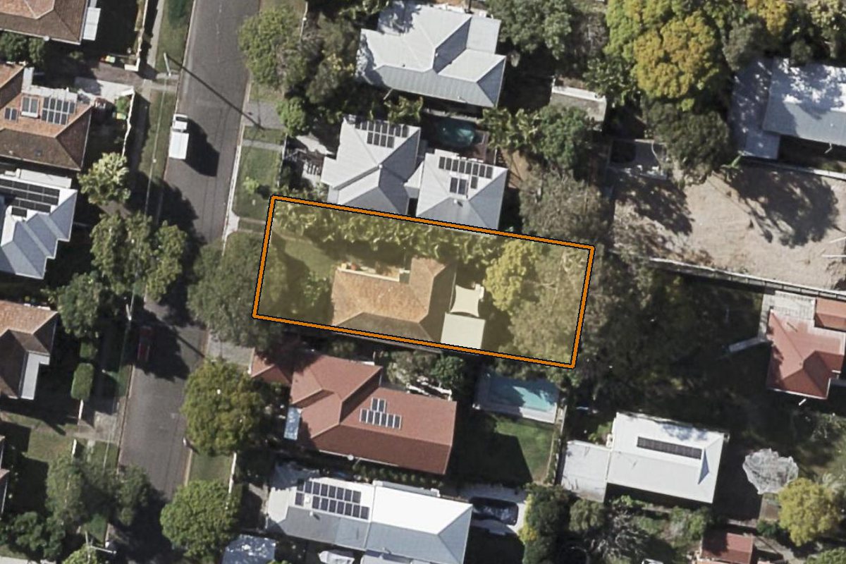 Aerial photo of 51 Moore Street, Enoggera QLD 4051 with the lot boundary outlined in amber