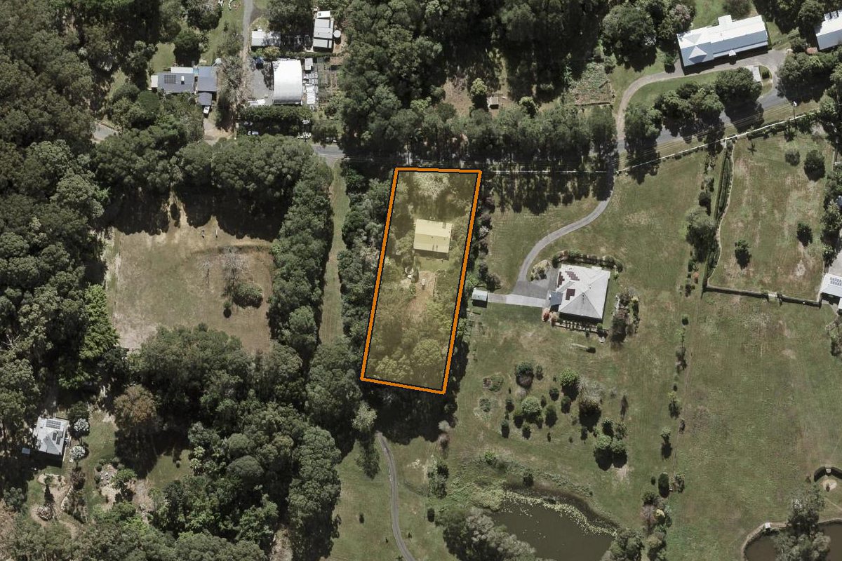 Aerial photo of 52 Winston Road South, Palmwoods QLD 4555 with the lot boundary outlined in amber
