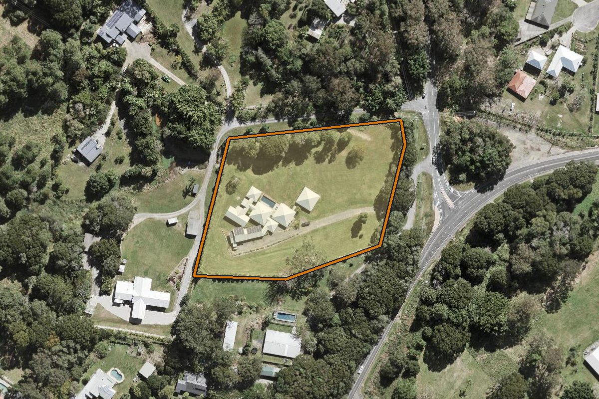 Aerial photo of 564 Currumbin Creek Road, Currumbin Valley QLD 4223 with the lot boundary outlined in amber