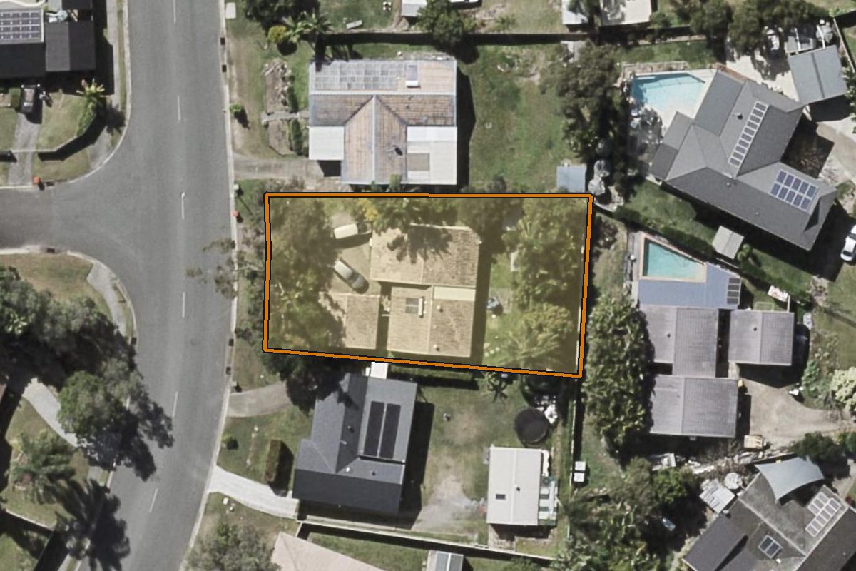 Aerial photo of 6 Cozens Way, Highland Park QLD 4211 with the lot boundary outlined in amber