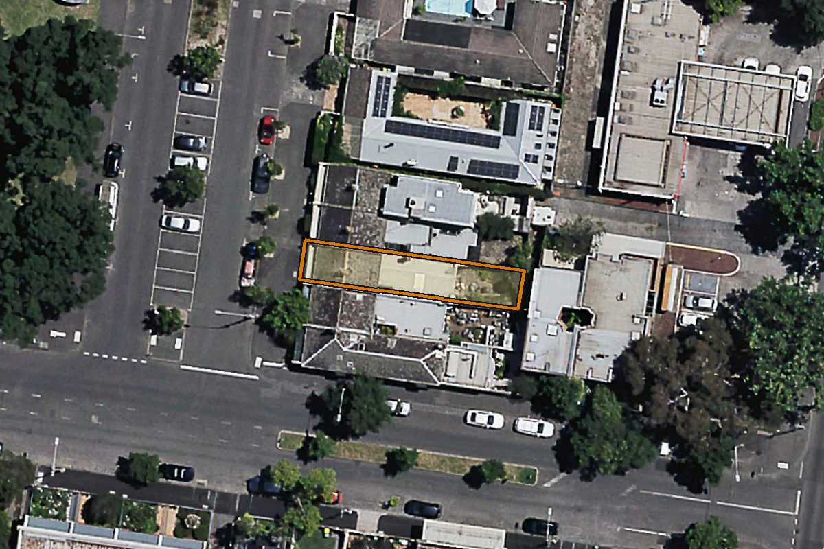 Aerial photo of 6 Darling Street, East Melbourne VIC 3002 with the lot boundary outlined in amber