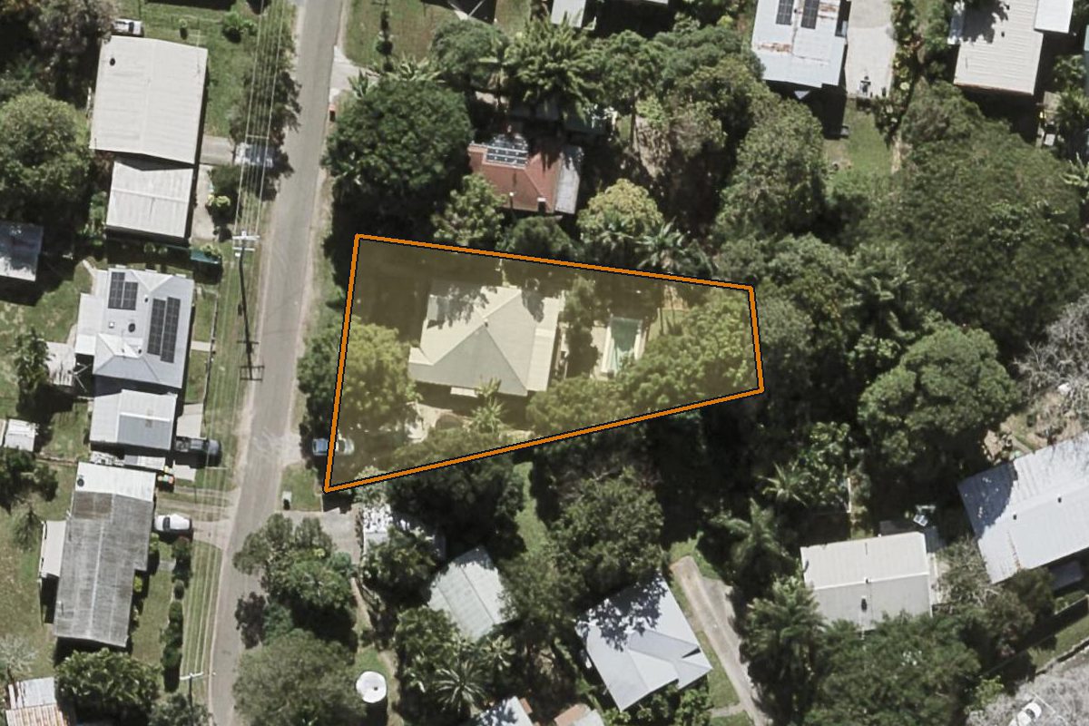 Aerial photo of 6 Mary Street, Palmwoods QLD 4555 with the lot boundary outlined in amber