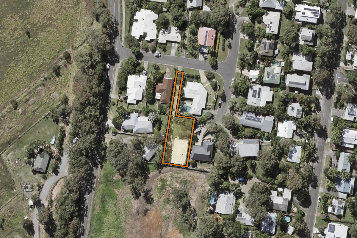 Aerial photo of 6 Scottlynd Street, Coolum Beach QLD 4573 with the lot boundary outlined in amber