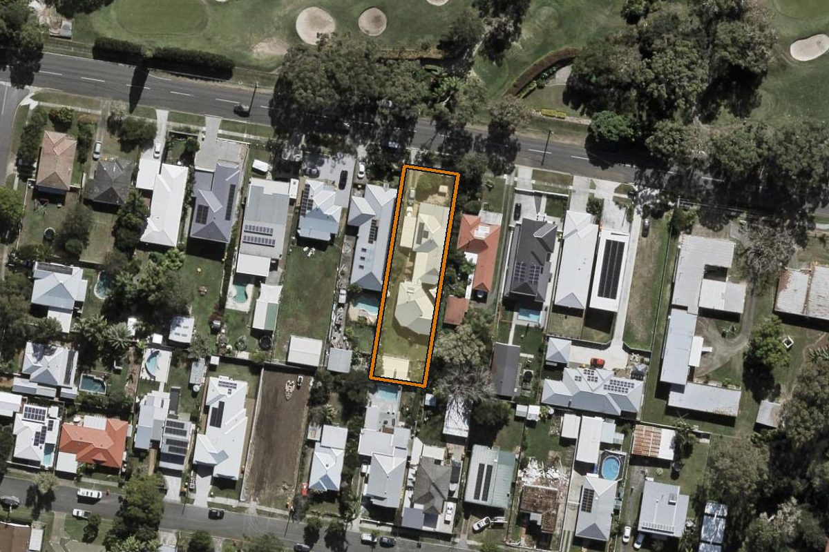 Aerial photo of 64 Chandos Street, Wynnum West QLD 4178 with the lot boundary outlined in amber