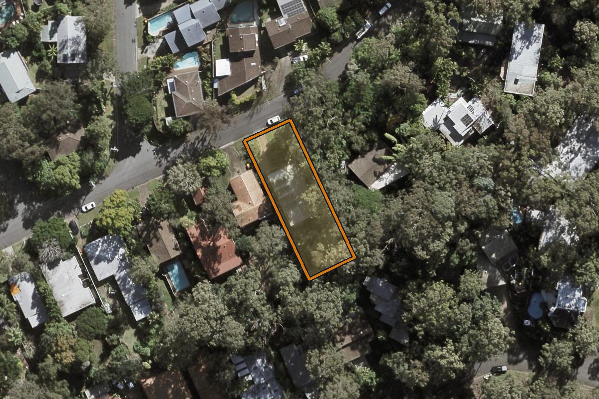Aerial photo of 65 Cassandra Street, Chapel Hill QLD 4069 with the lot boundary outlined in amber