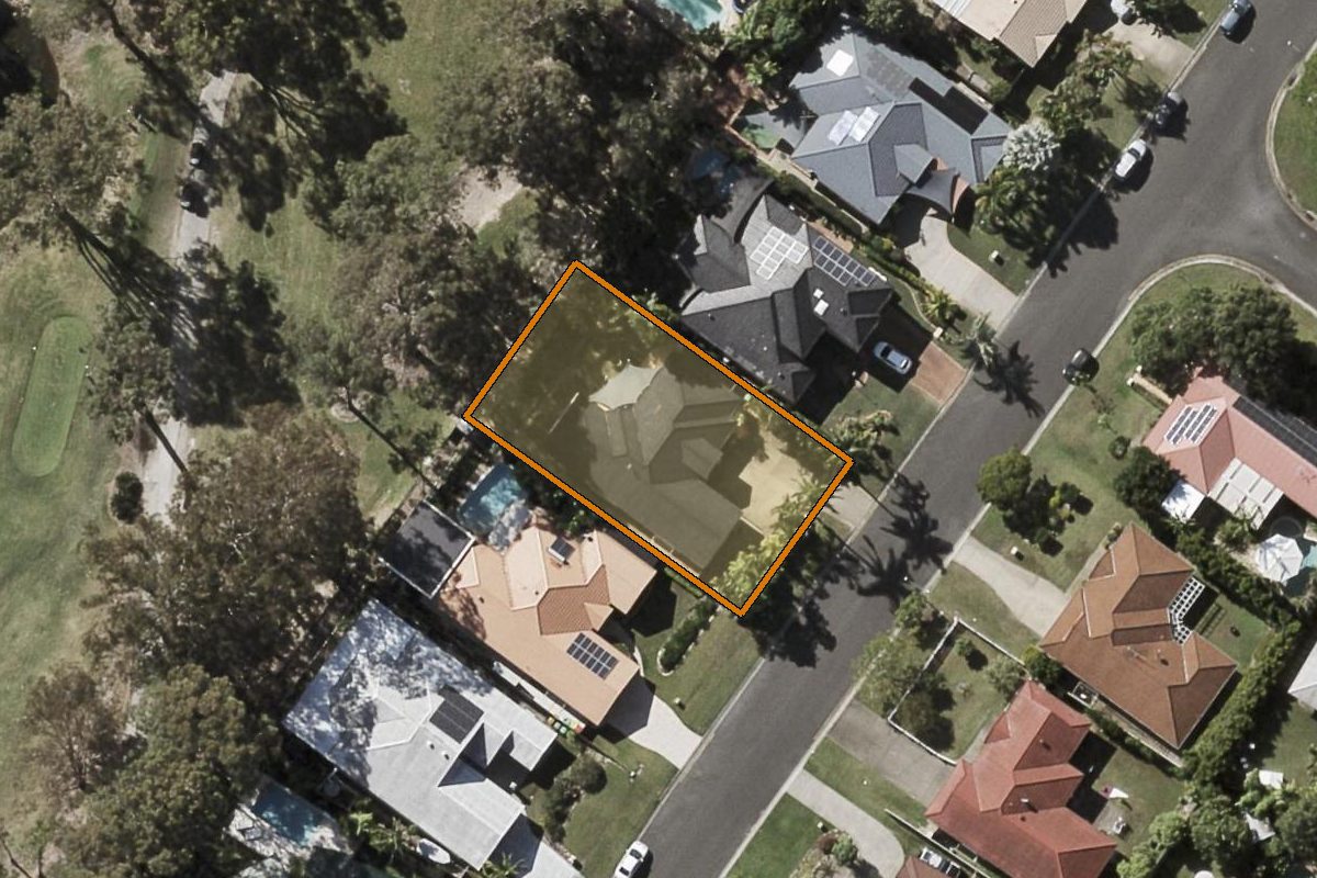 Aerial photo of 69 Inverness Way, Parkwood QLD 4214 with the lot boundary outlined in amber