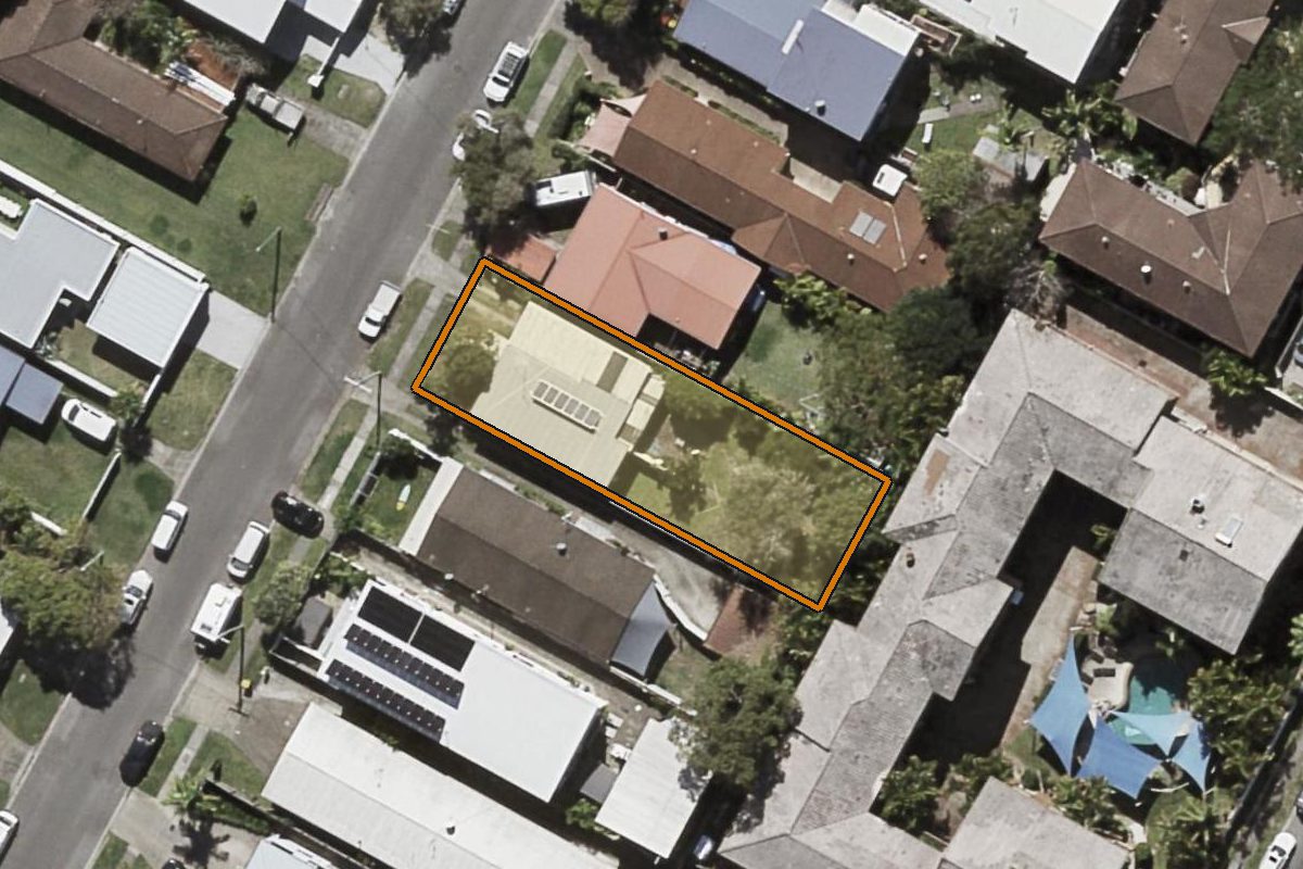 Aerial photo of 69 Leyte Avenue, Palm Beach QLD 4221 with the lot boundary outlined in amber