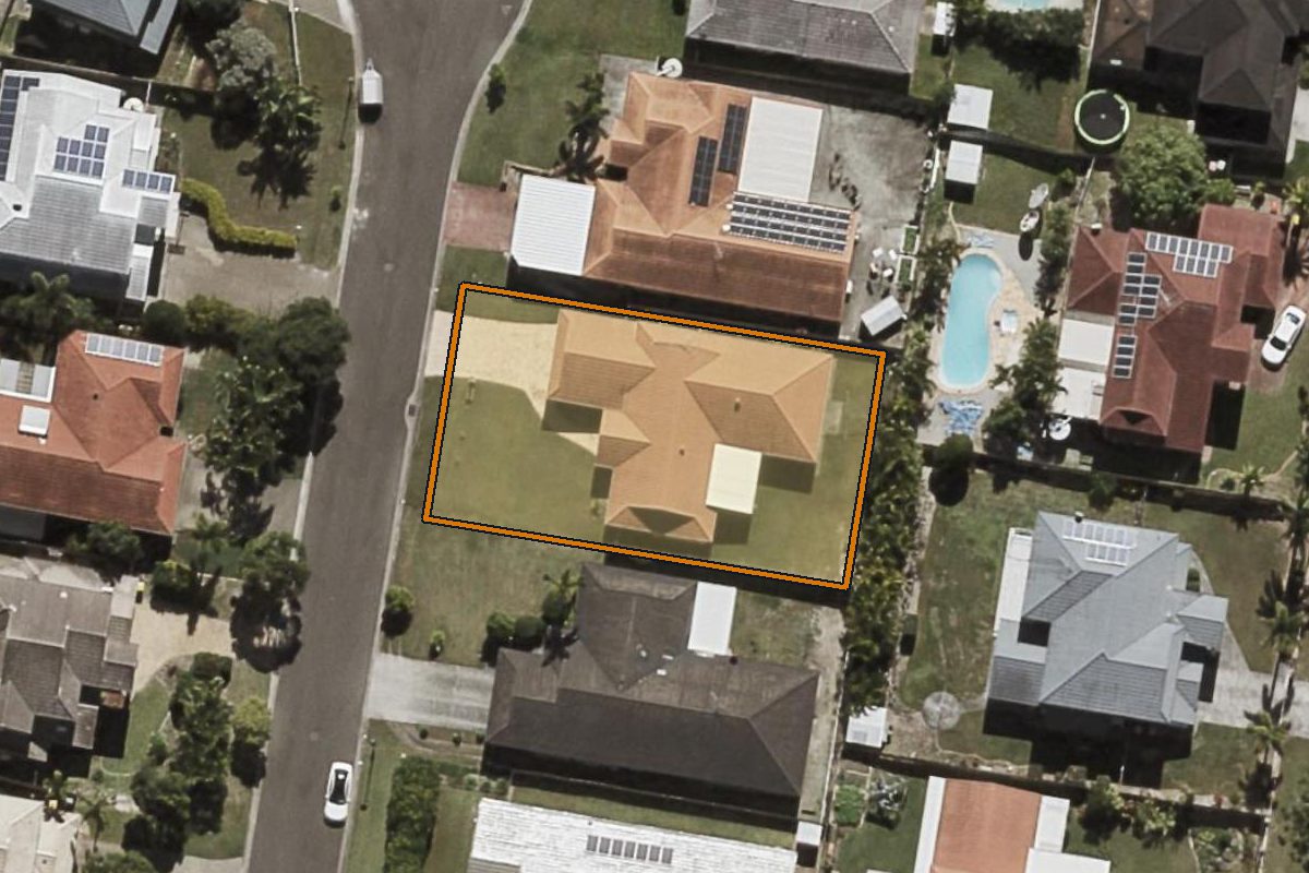 Aerial photo of 7 Buckinghamia Place, Stretton QLD 4116 with the lot boundary outlined in amber