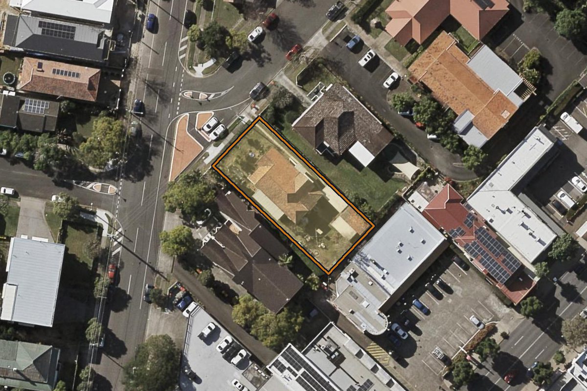 Aerial photo of 7 Victoria Street, Clayfield QLD 4011 with the lot boundary outlined in amber