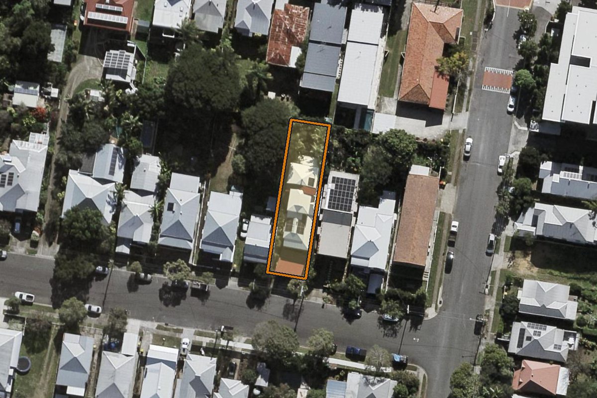 Aerial photo of 7 Walker Street, Windsor QLD 4030 with the lot boundary outlined in amber