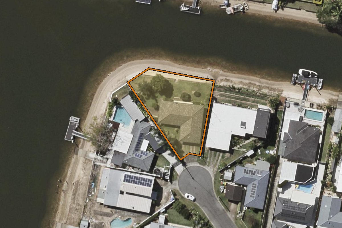 Aerial photo of 75 Kalimna Drive, Broadbeach Waters QLD 4218 with the lot boundary outlined in amber