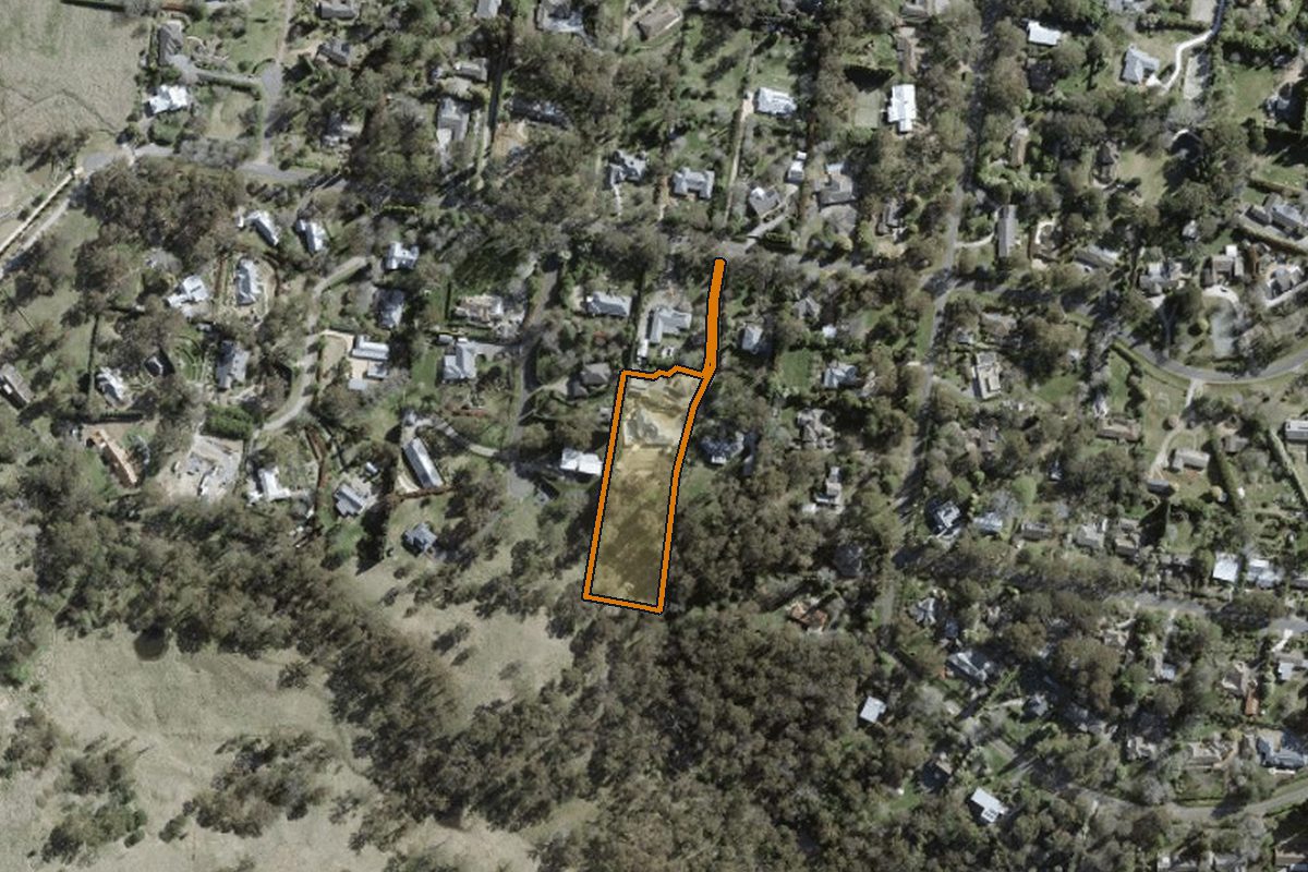 Aerial photo of 7b Hopewood Road, Bowral NSW 2576 with the lot boundary outlined in amber