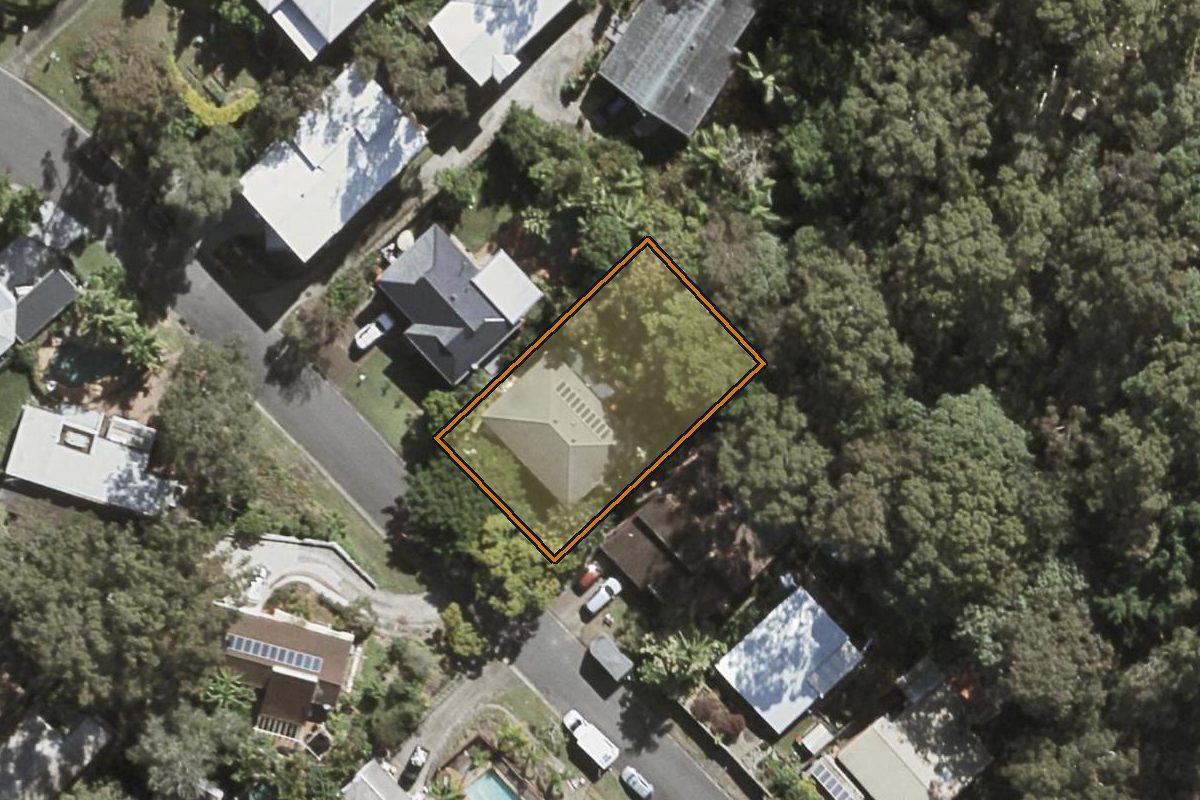 Aerial photo of 9 Tamarix Street, Chapel Hill QLD 4069 with the lot boundary outlined in amber