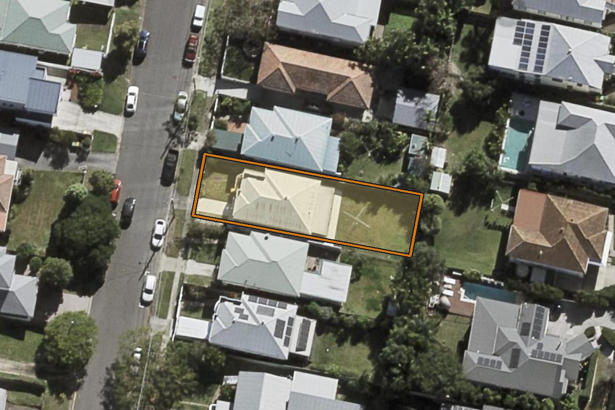 Aerial photo of 90 Cedar Street, Greenslopes QLD 4120 with the lot boundary outlined in amber